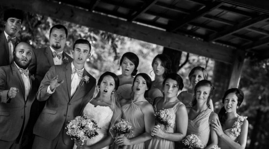 wedding  a picture taken the exact moment a photographer falls over