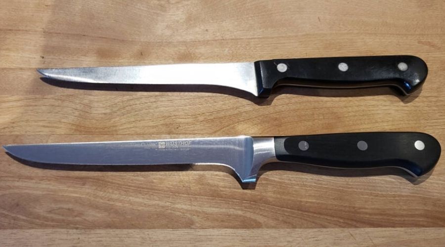 two of the same knives, one has been worn down