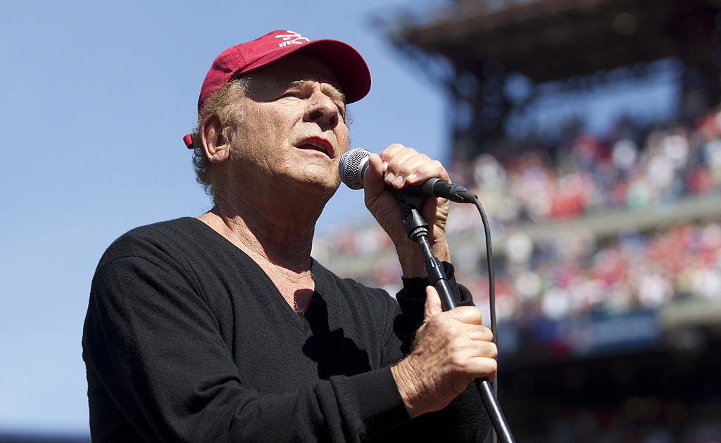 Art Garfunkel performing at a baseball game 
