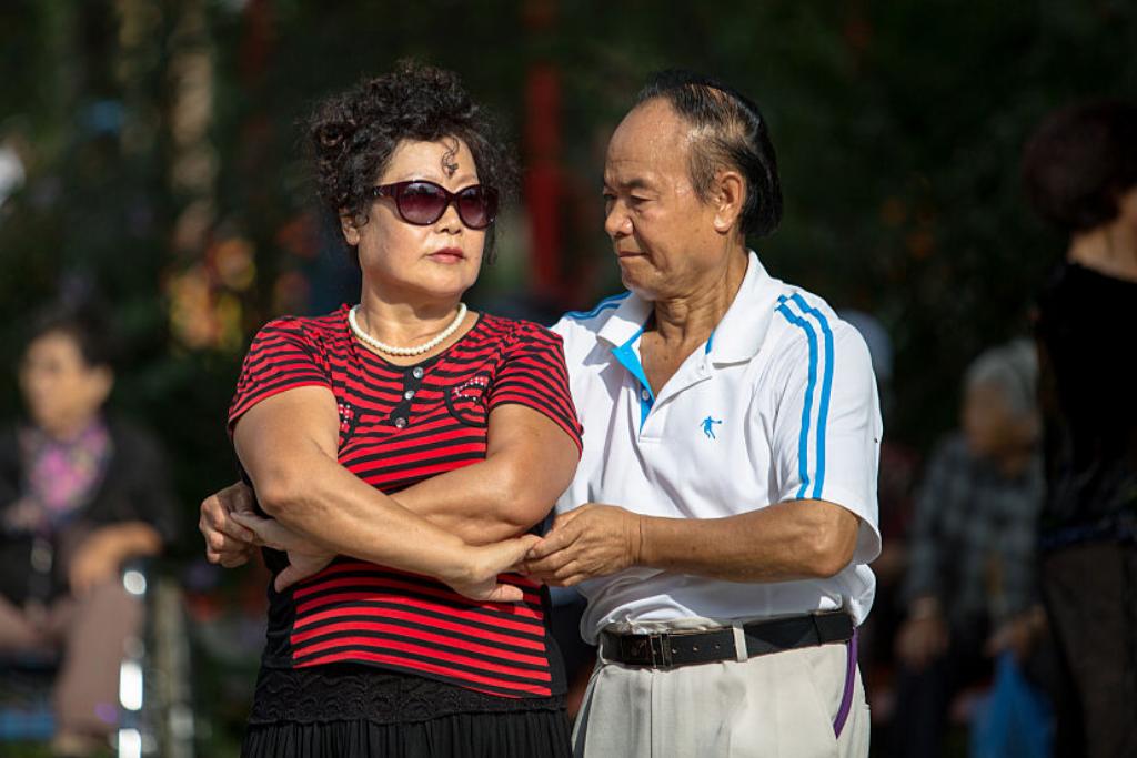 dancing-old-couple A retired couple dances in the street.
