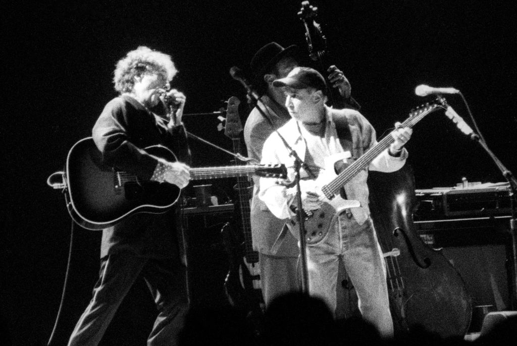 Paul Simon playing with Bob Dylan