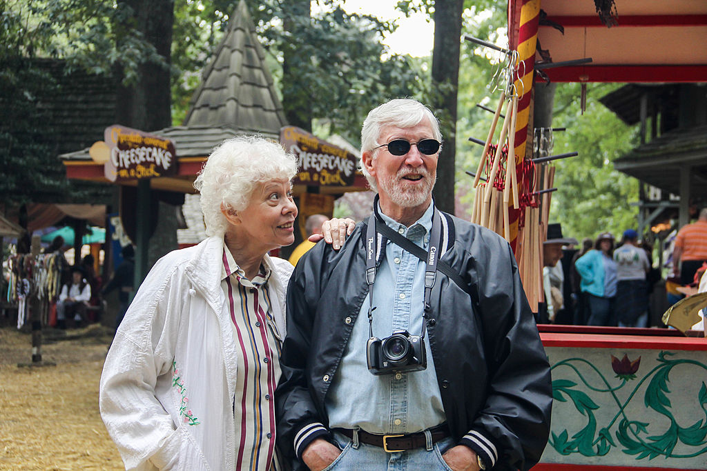 elderly-couple-having-fun An elderly couple enjoys a festival.