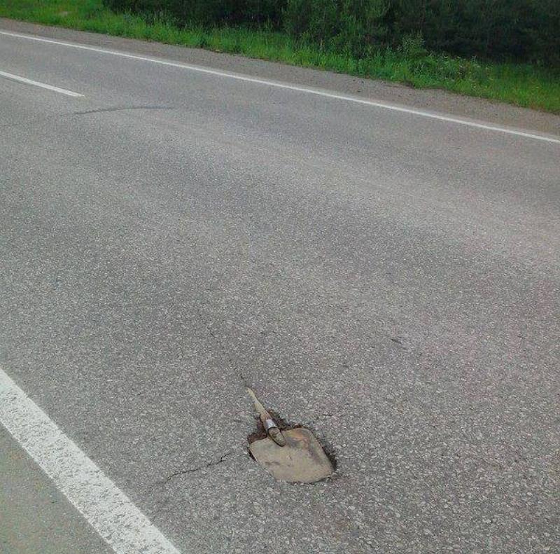 shovel paved in the middle of road
