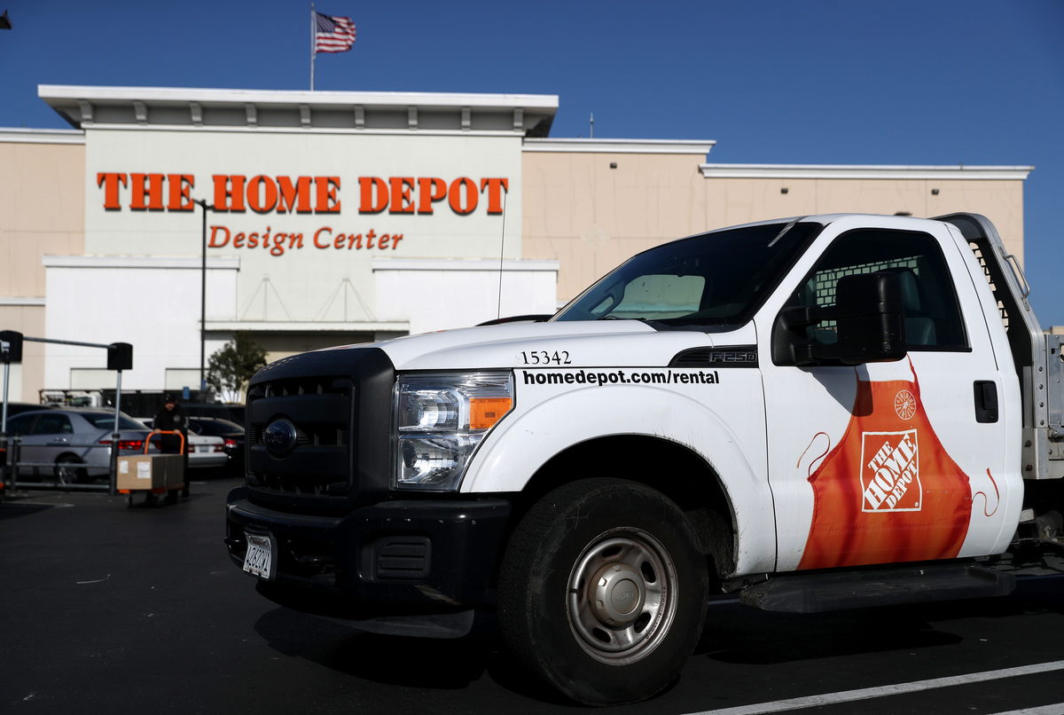A Home Depot rental truck is parked in the background.