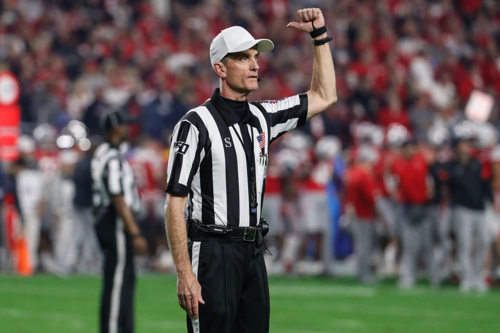 referee-doing-ejection-sign A referee does an ejection sign.