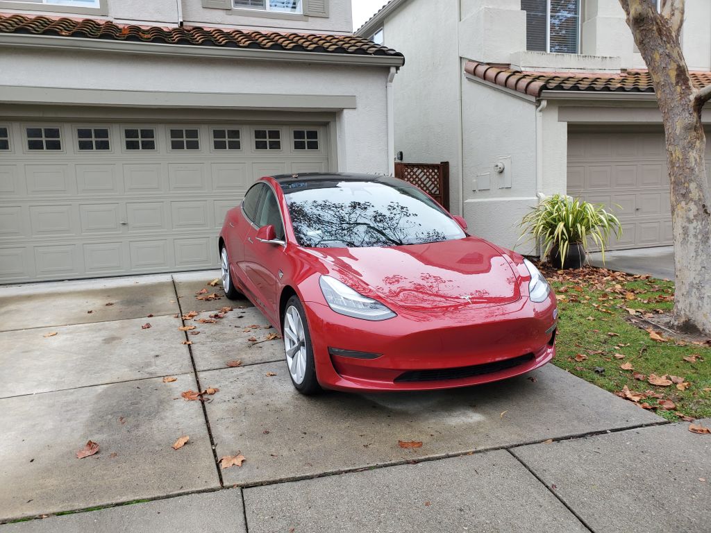 car-parked-backwards-in-a-driveway A car is parked backwards in a driveway.