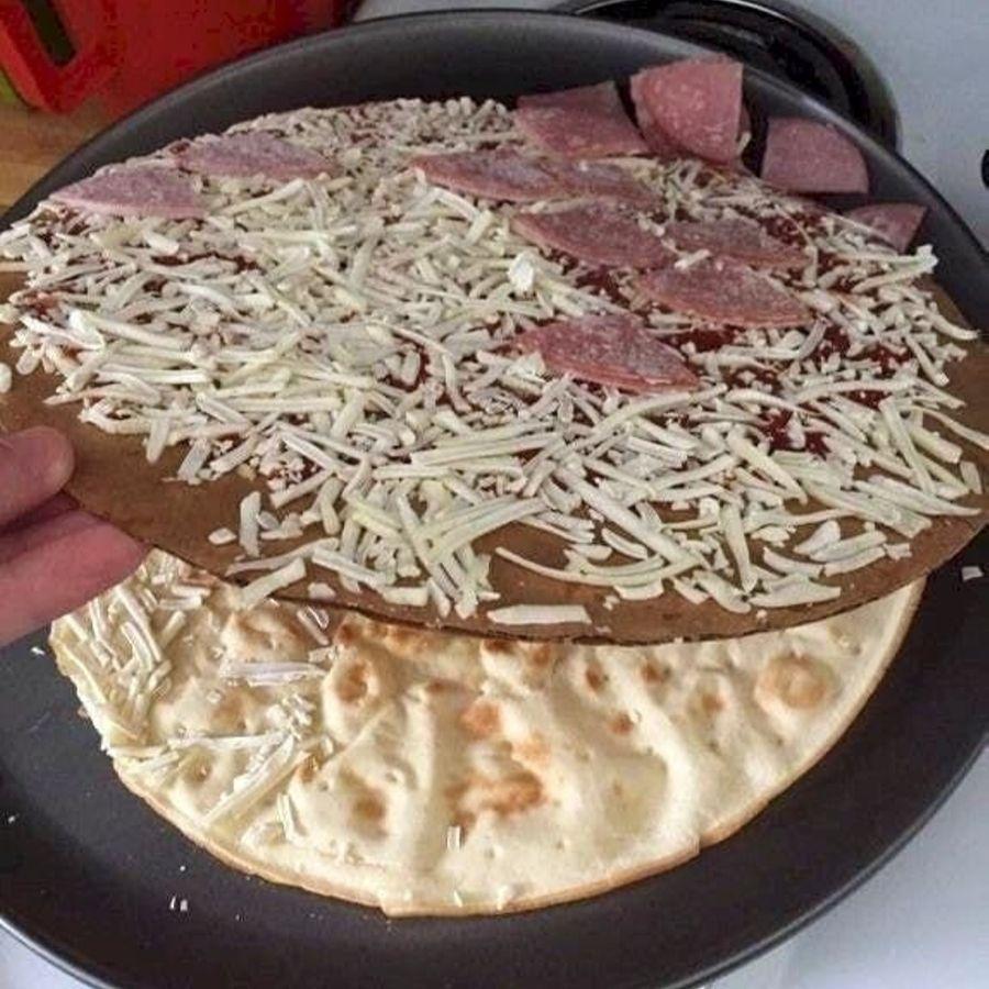 frozen pizza with all the toppings on the cardboard
