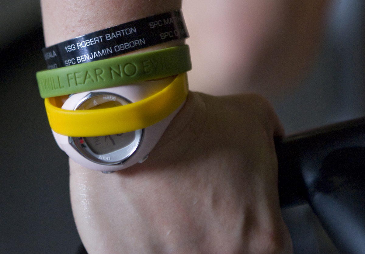 livestrong bracelets - 106545018 A woman wears rubber bracelets over a watch.
