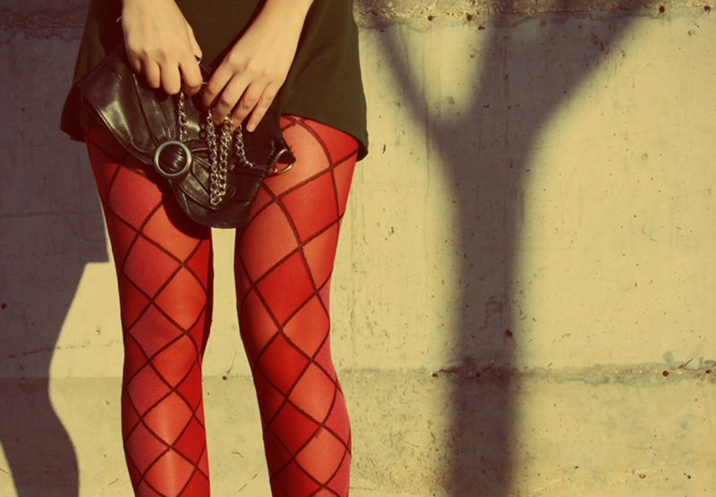 red tights A woman wears red tights with a diamond pattern.