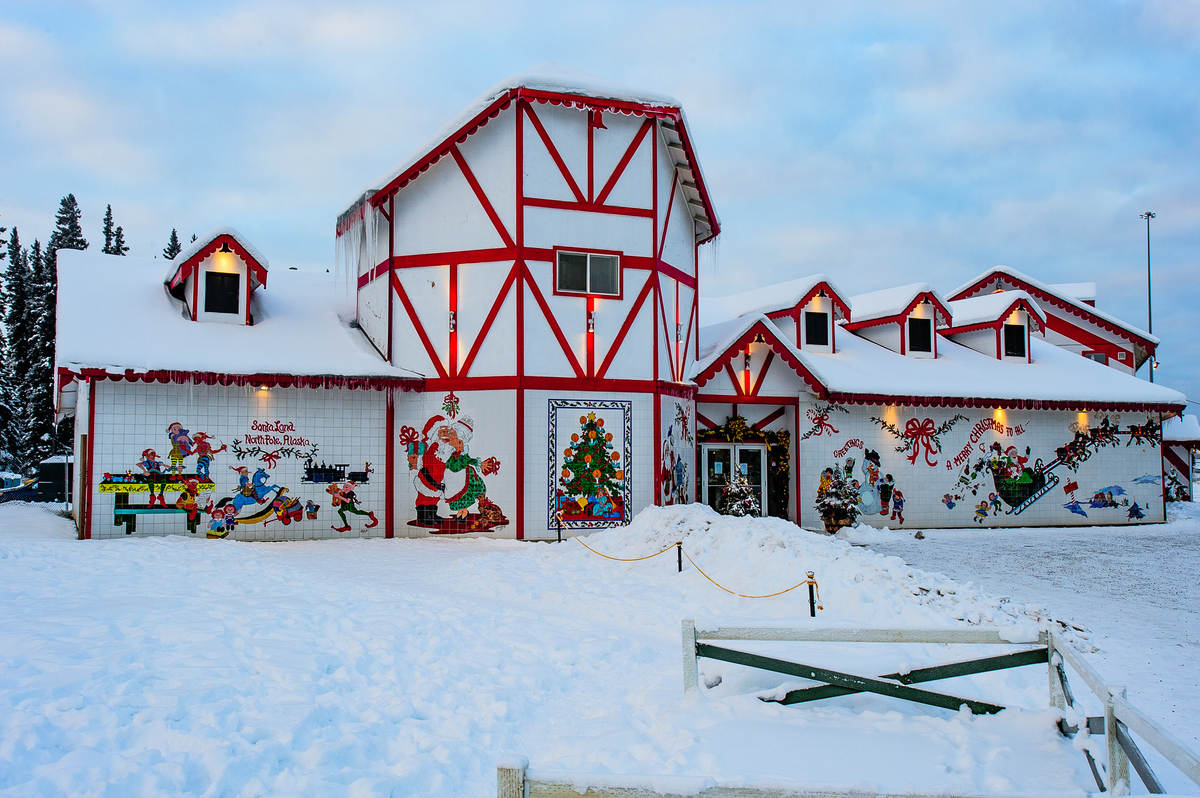 a house covered in snow and christmas decorations