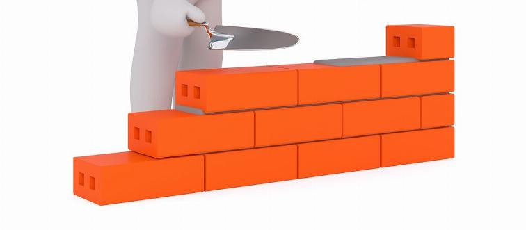 An animated figure builds a wall.