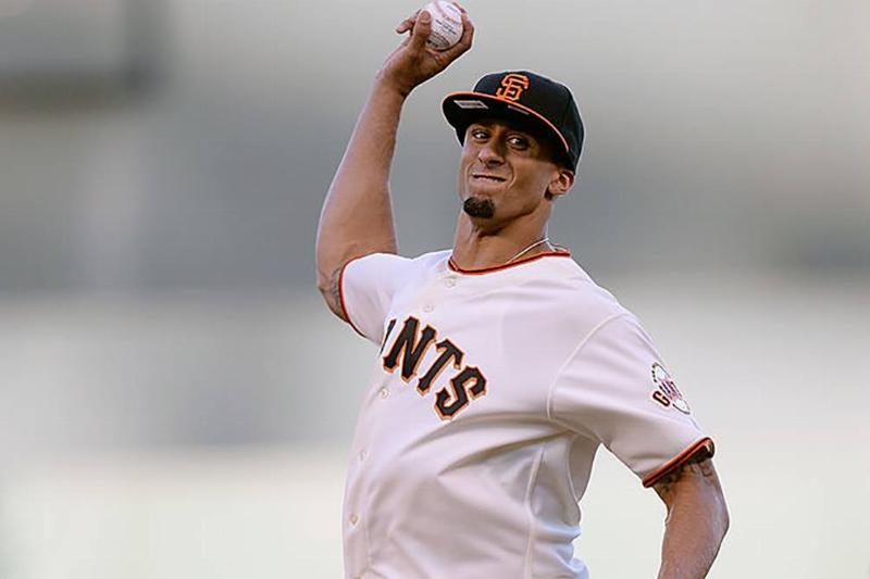 Kaepernick throwing a baseball 