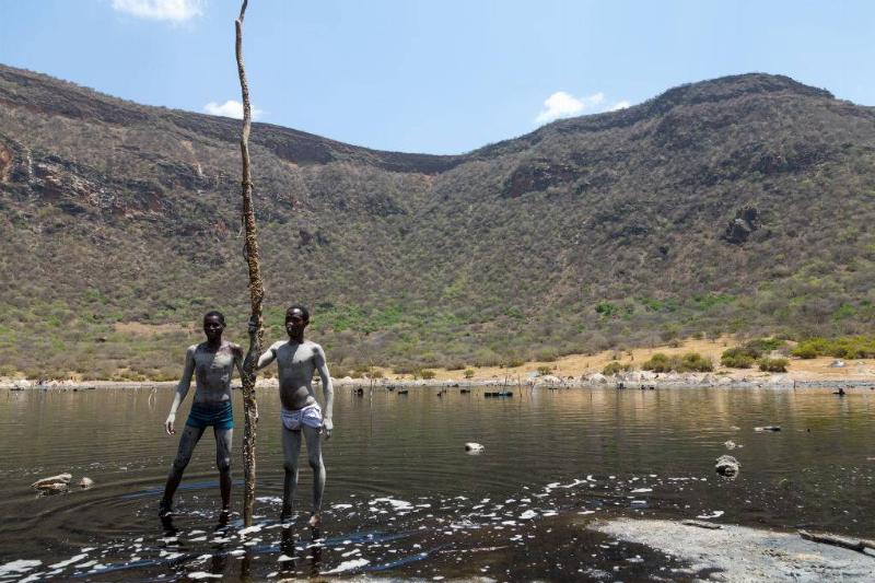 Boys holding a stick 