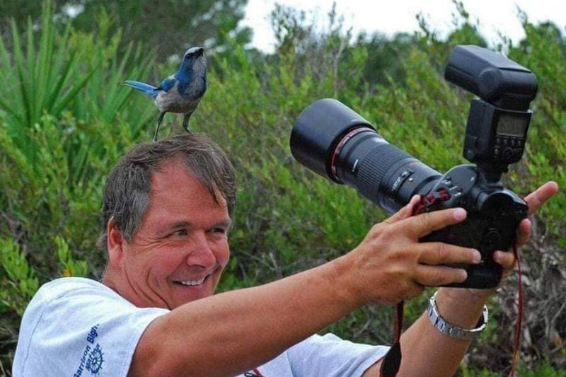 bird-on-photographers-head-88086