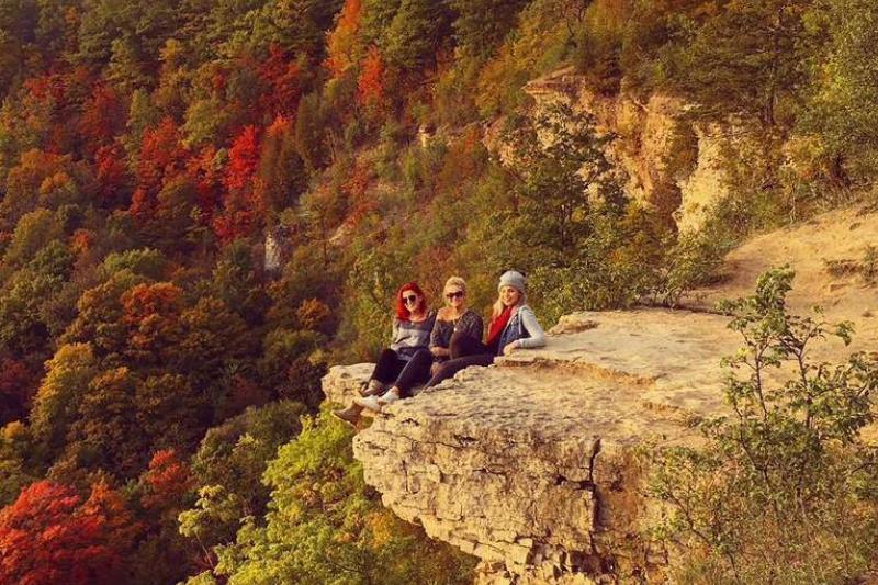 Woman pose together at Dundas Peak.