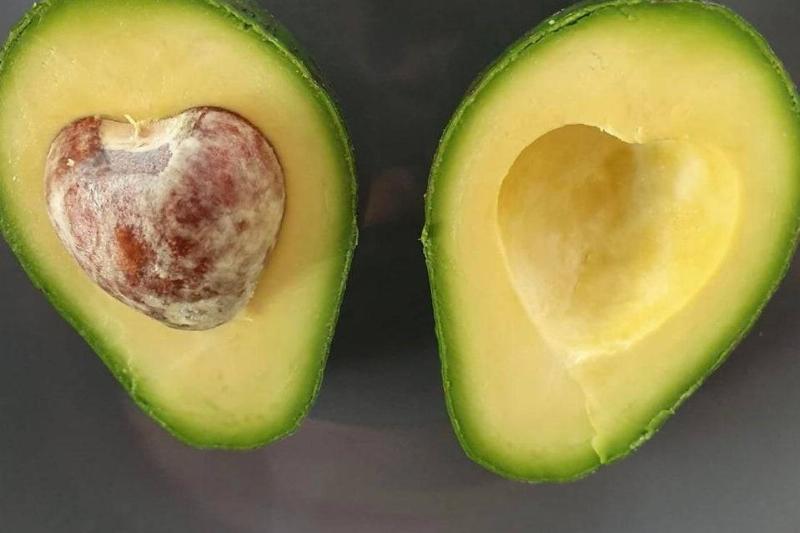 an avocado with a heart pit