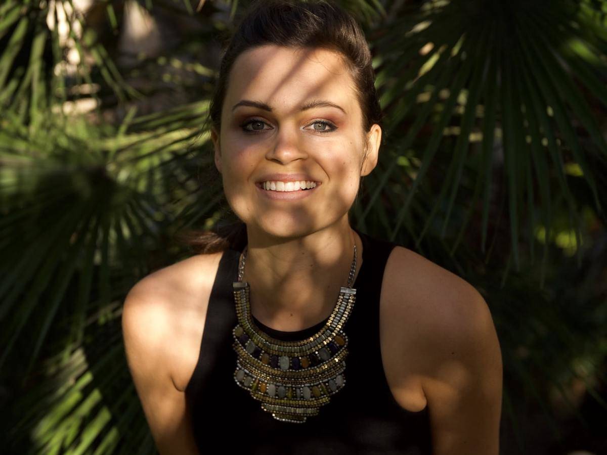 a necklace on a woman 