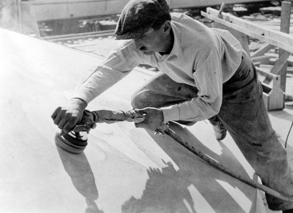 Man polishing ship 