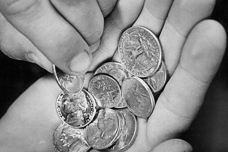 Person holding change 