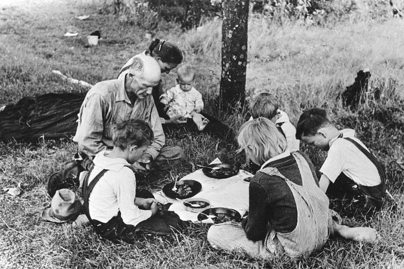 Family eating on the side of the road