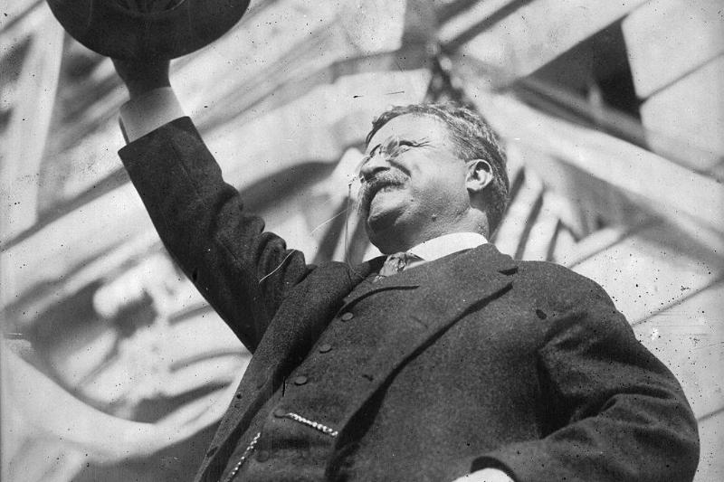 Roosevelt waving his hat 