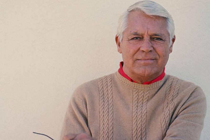 Cary Grant in a sweater and red shirt 