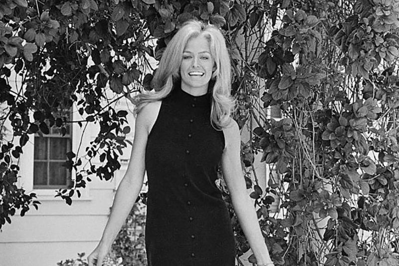 Fawcett in a black dress