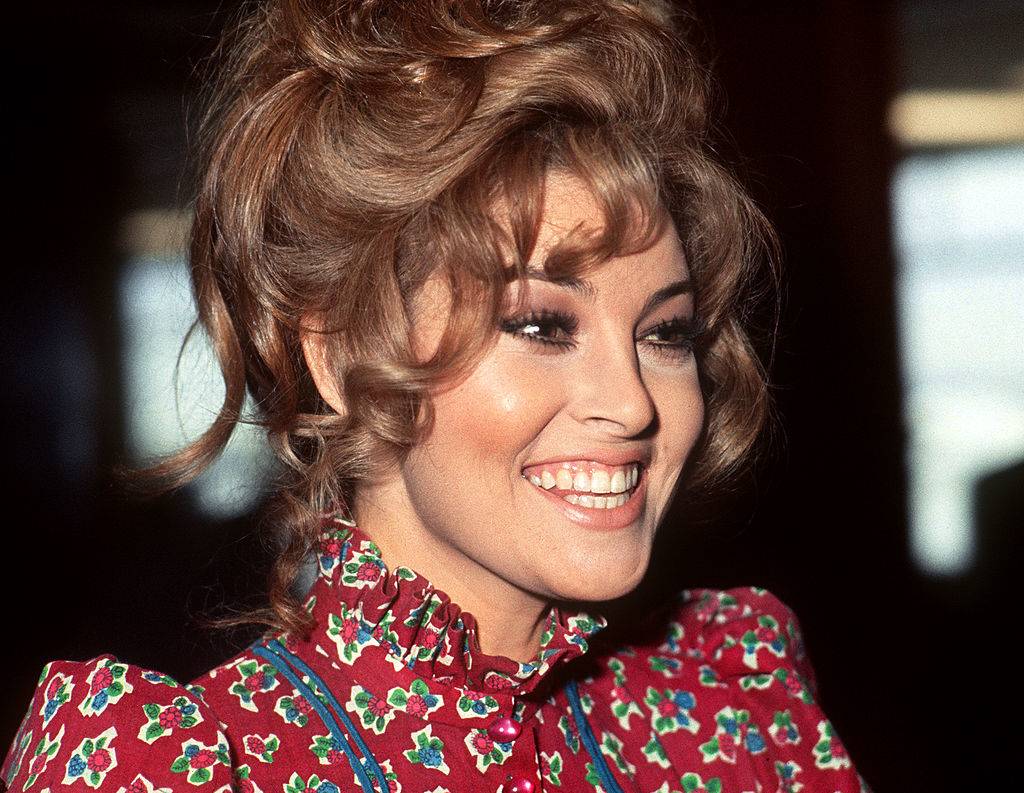 ORLY, FRANCE: US actress Raquel Welch poses for the press 14 January 1970 upon her landing at Paris Orly airport. Welch and US producer Patrick Curtis have married one month later at the City Hall of Paris 8th district.