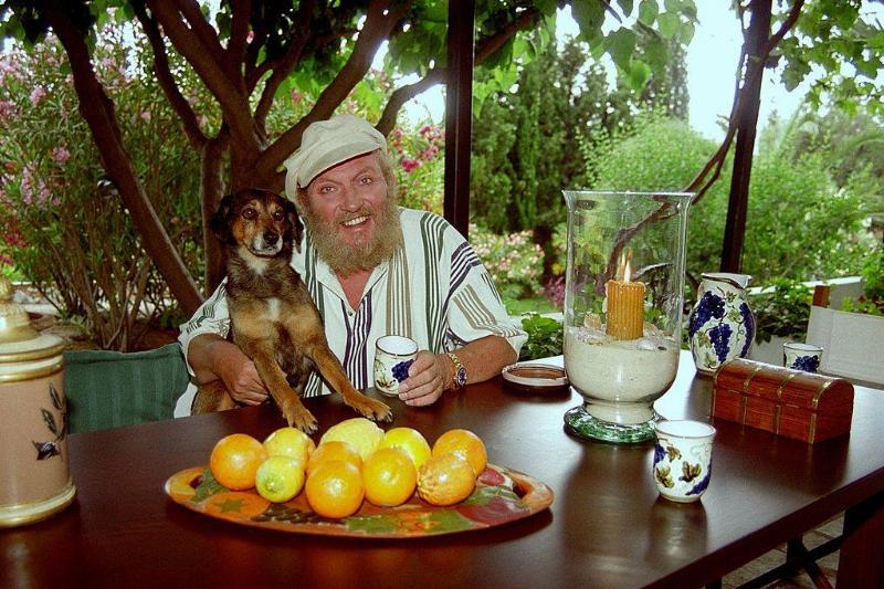 lemons and limes 177882166 a man and his dog at a table full of lemons
