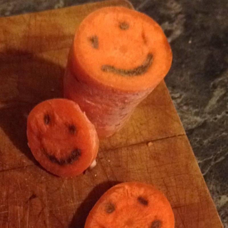 a carrot looks like it has a smile in it 