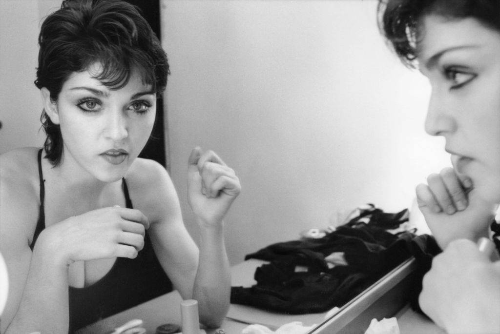 American singer Madonna reflected in a dressing room mirror, New York City, Spring 1979. She has recently moved to New York City to study dance.