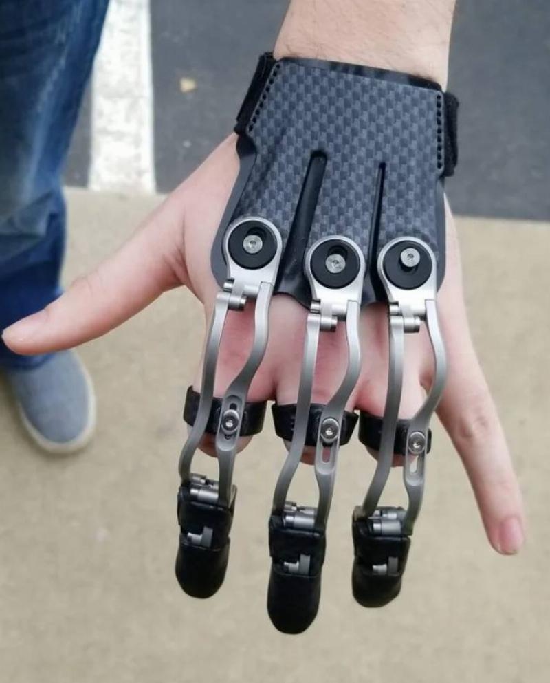 prosthetic fingers fit over hand like a half glove