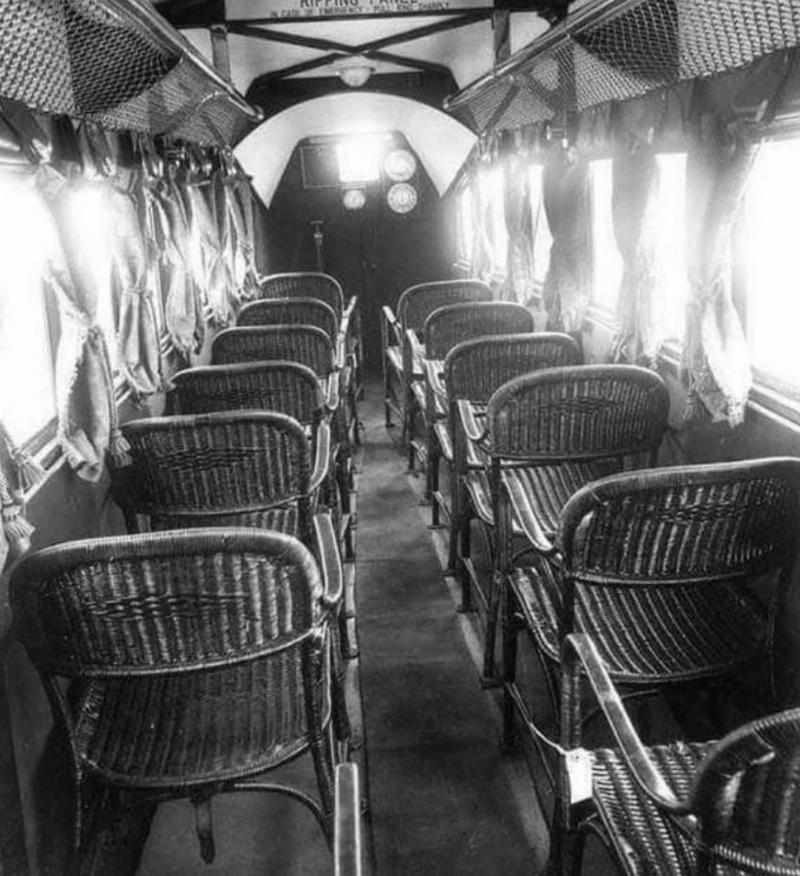 inside of a passenger plane has wicker seats