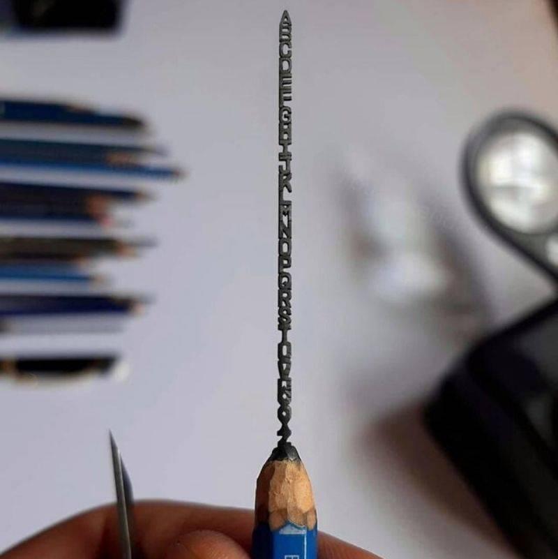 someone carved the alphabet into pencil lead