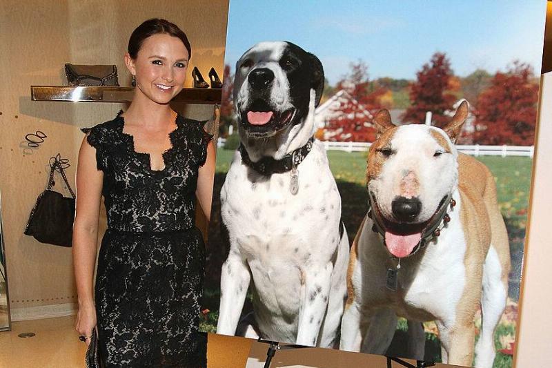 Georgina Georgina Bloomberg poses next to a photo of her dogs