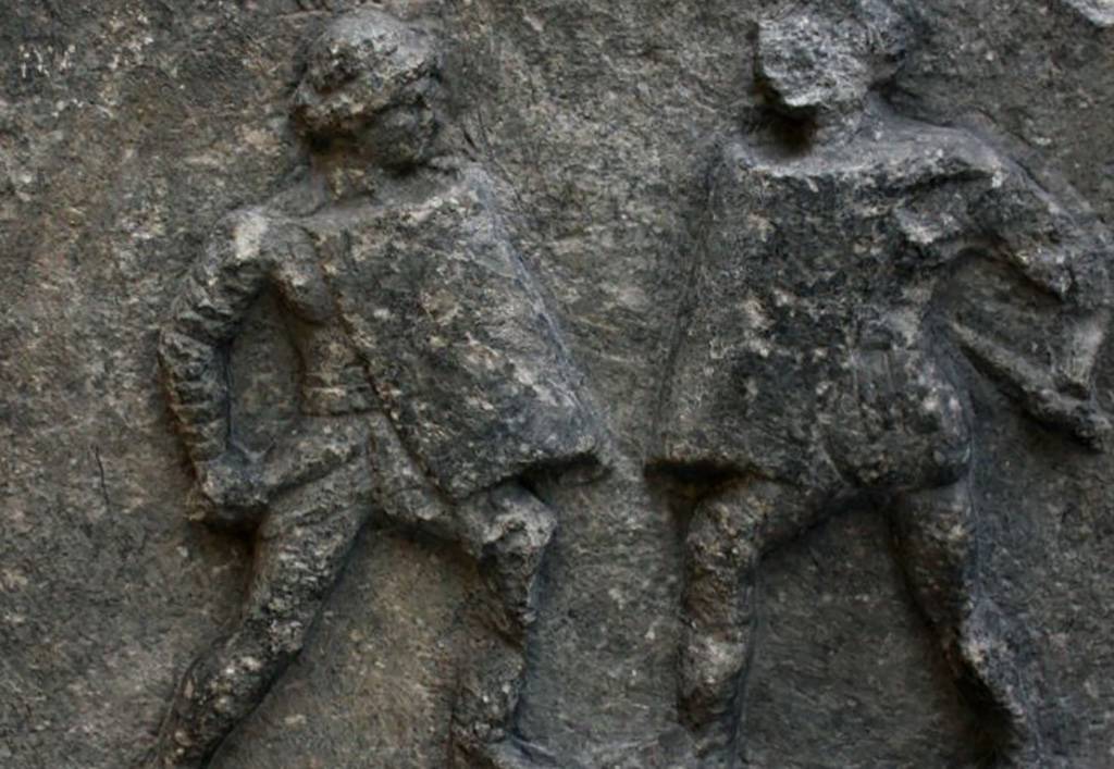 Relief of two men fighting 