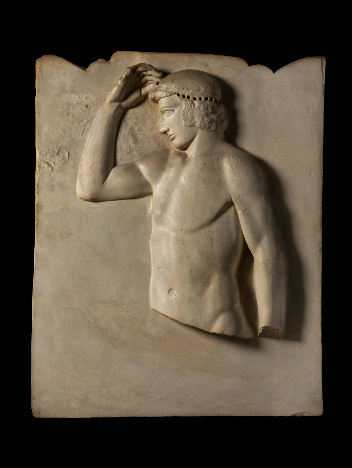 On this ancient Greek stele, a man touches his hair.