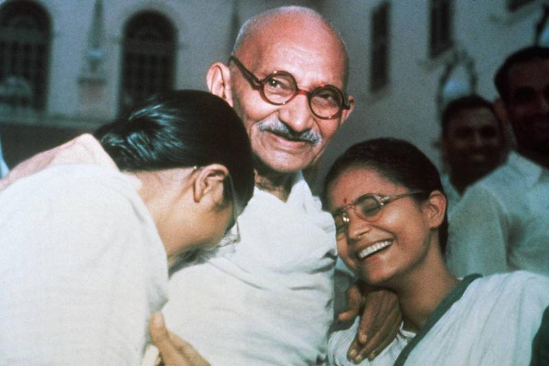 gandhi laughing with his granddaughters