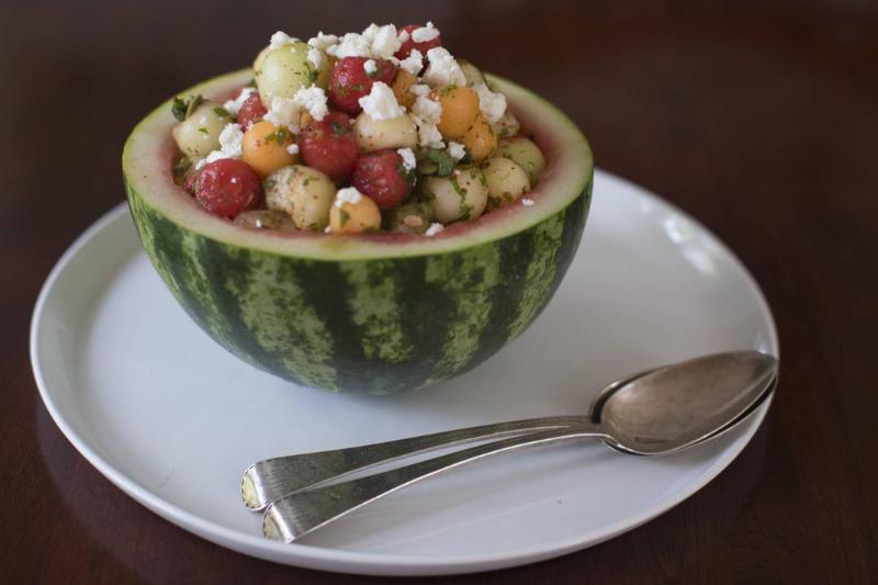 feta salad - 1012857450 A melon-chili salad is topped with feta cheese.