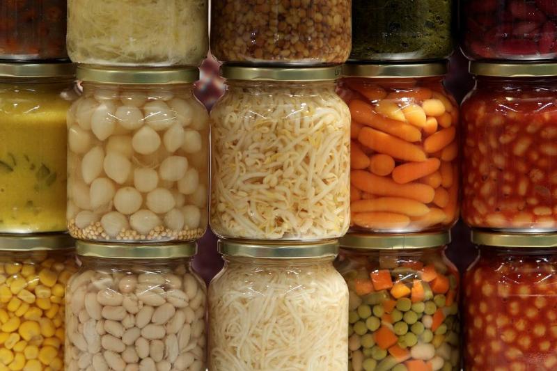 canned vegetables - 109176187 Canned vegetables are stacked and on display.