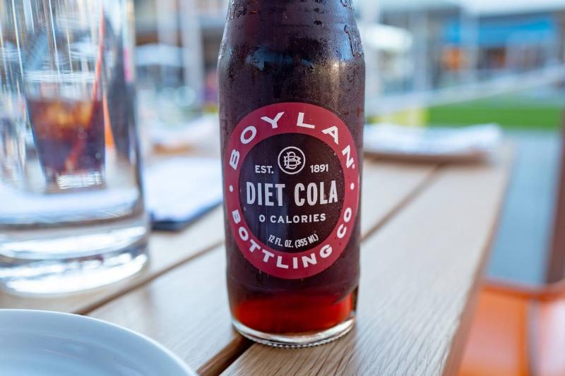 diet soda - 1212072297 A bottle of diet cola sits on a restaurant table.