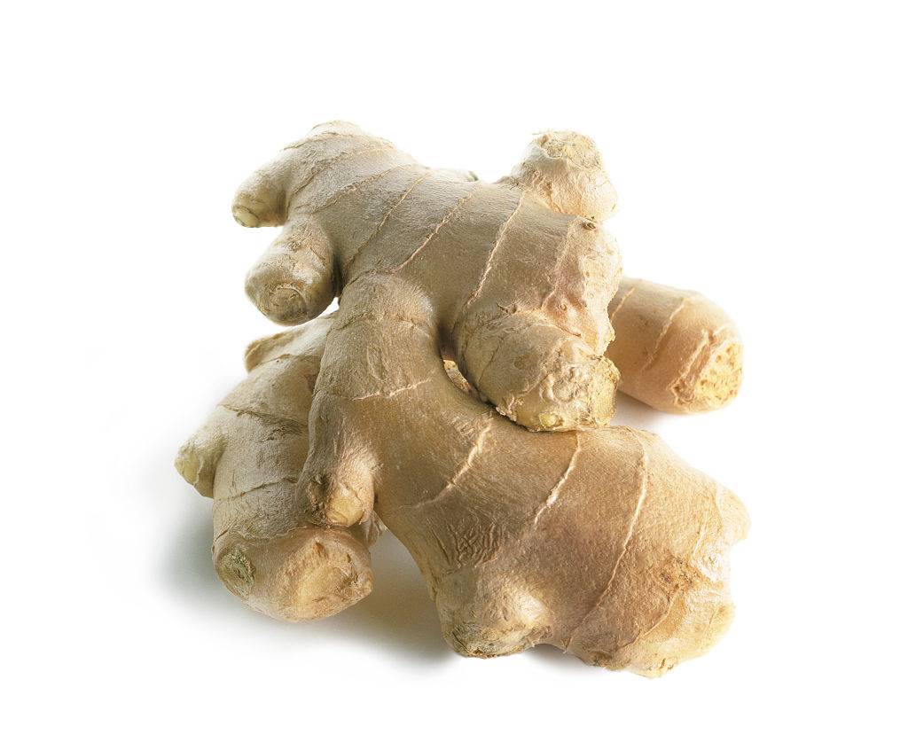 a few pieces of ginger against a white background