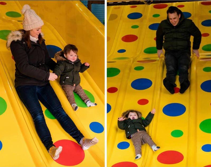 kid riding slide with mom vs with dad