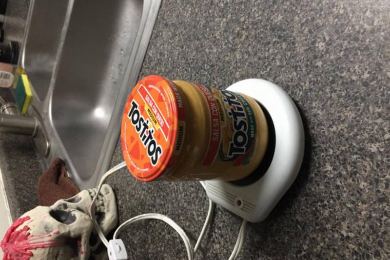 jar of queso dip on a small hotplate