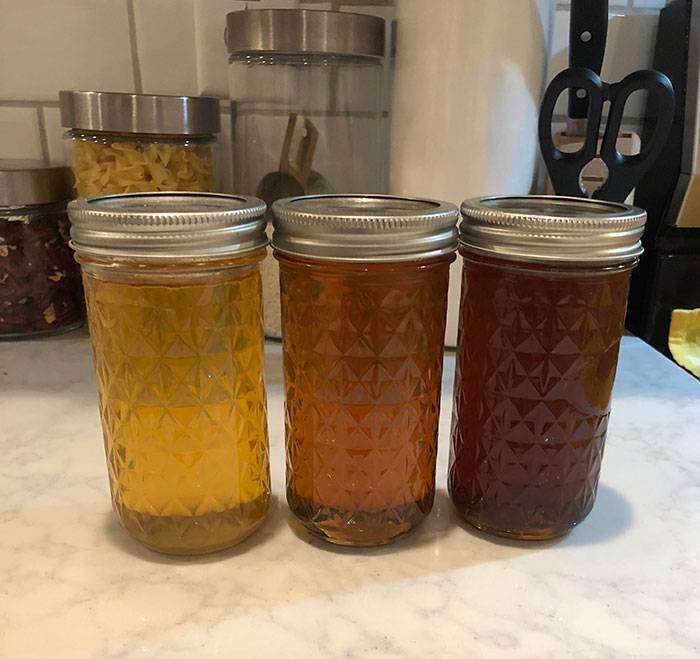 three jars of honey different colors