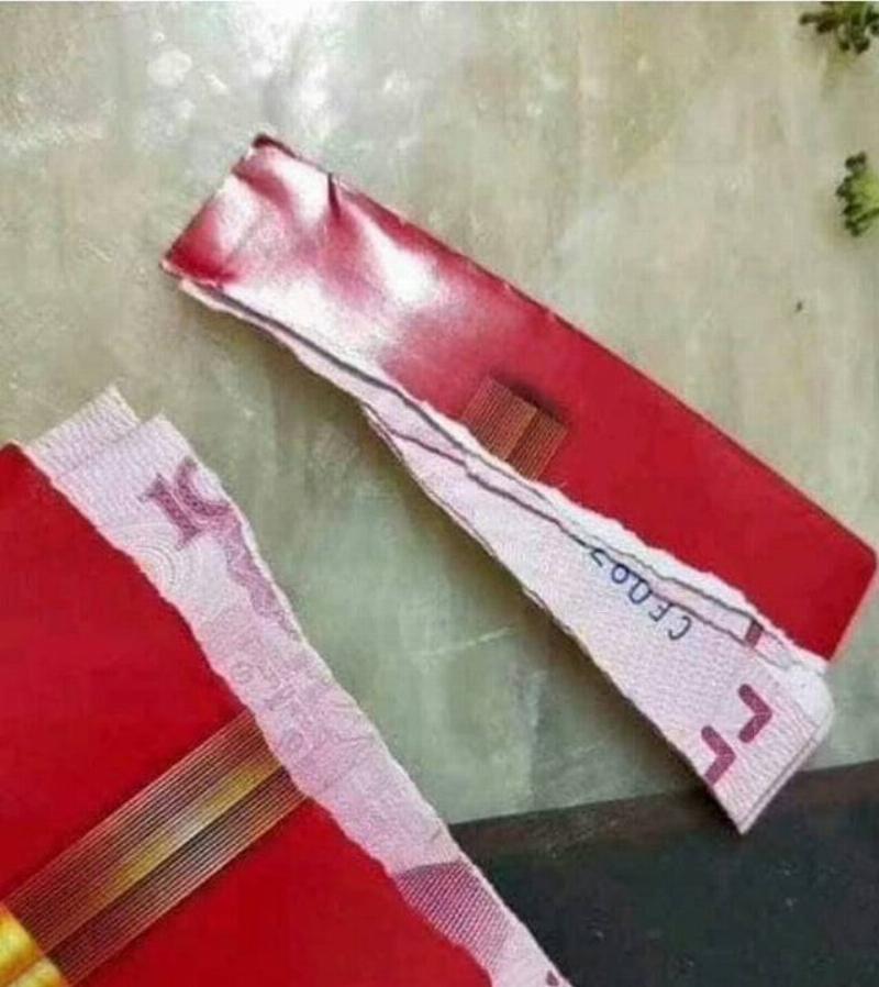 someone accidentally ripped the money in a gift envelope