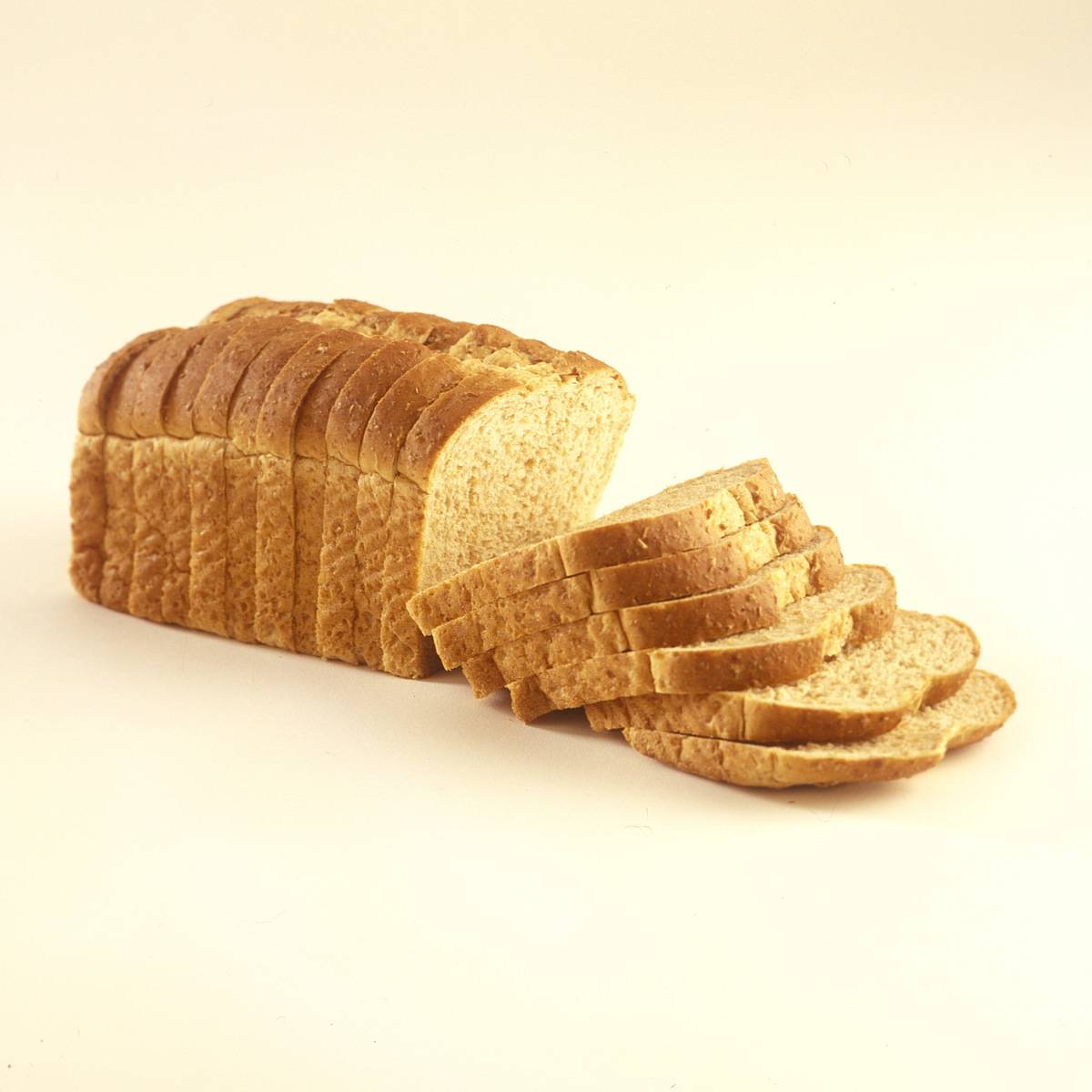 A loaf of bread is sliced.