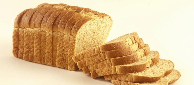 A loaf of bread is sliced.