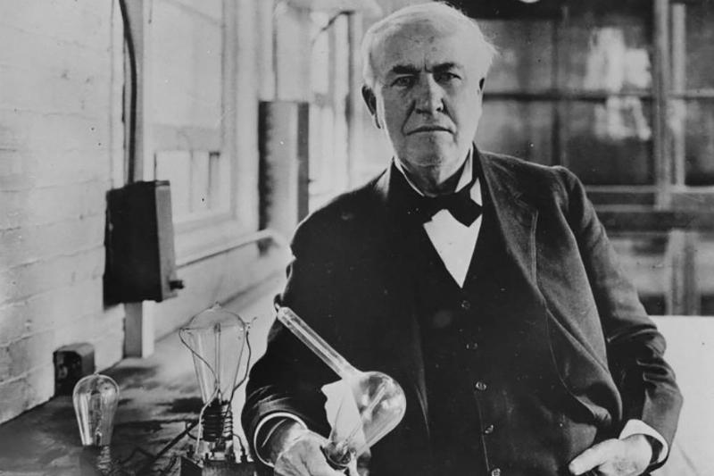 Thomas Edison with light bulb 