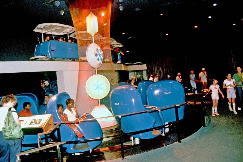 adventure through inner space adventure through inner space ride with people sitting in blue pods at disneyland